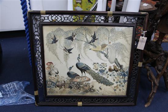 A Chinese embroidered silk picture of birds amid rockwork and foliage, late 19th / early 20th century, 56 x 63cm, losses to frame